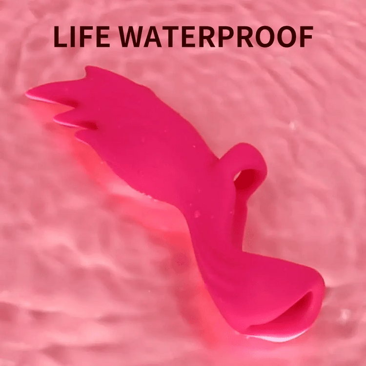 Water-resistant Angel Wings finger vibrator shown on a wet surface