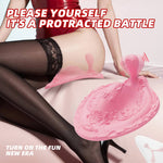 Woman demonstrating the pink Phoenix vibrating anal plug in a seated position