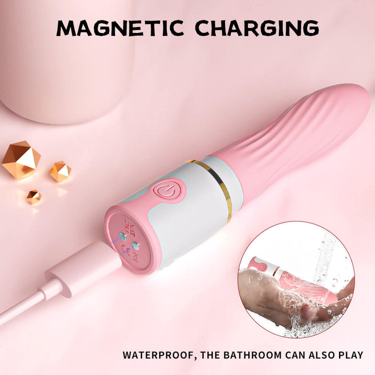 Stun Bomb vibrator connected to its magnetic charger with a water-resistance inset
